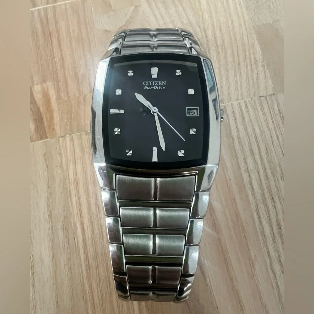 Citizen eco-drive rectangular black dial silver tone solar dress watch